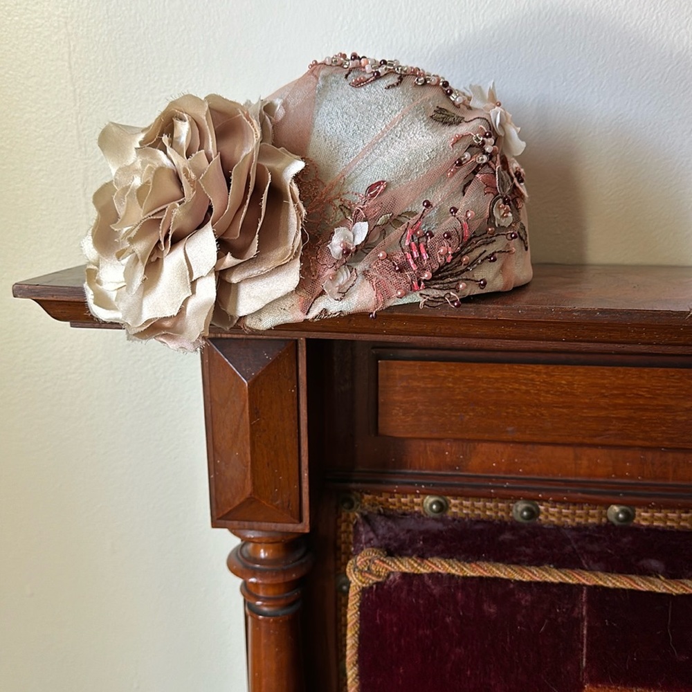 Custom millinery hat. Silk rose. Formed felt interior. Beaded tulle.
